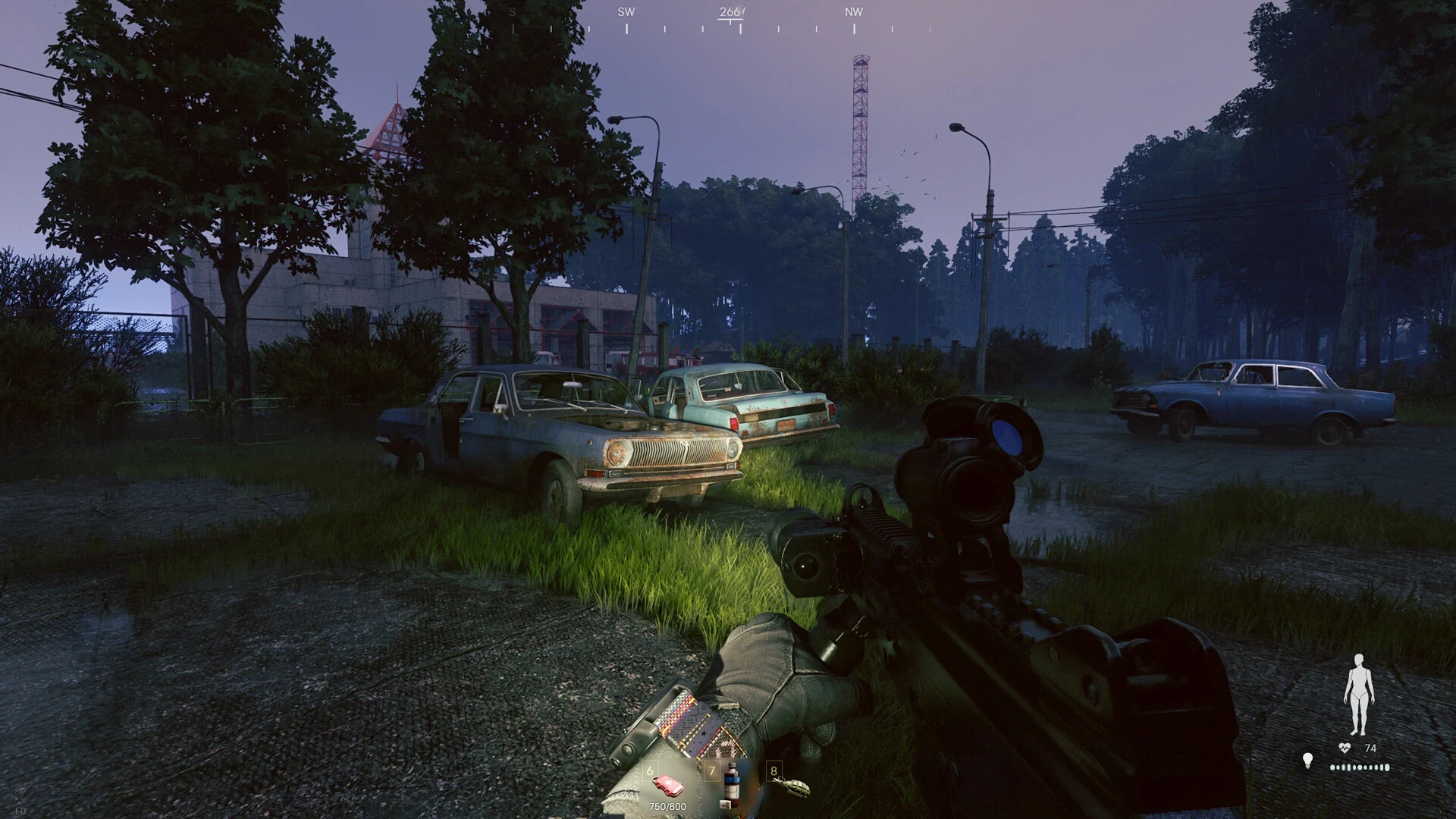 Official first-person scene on a dark road with abandoned vehicles